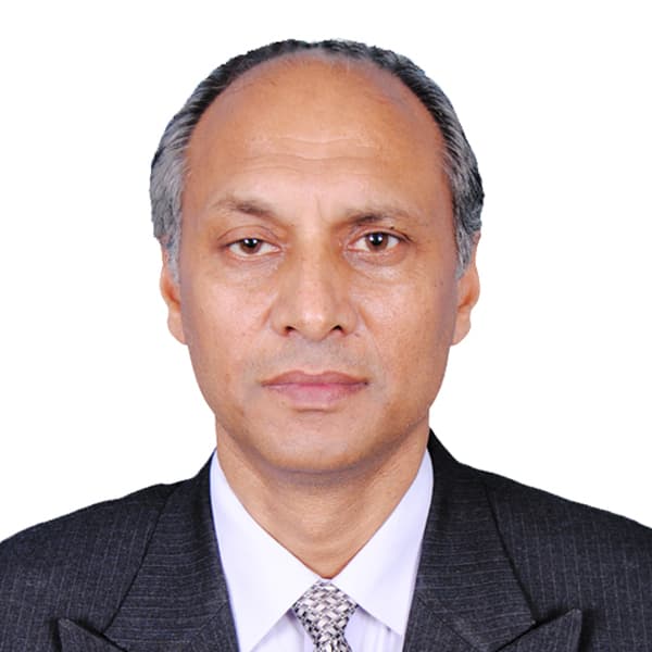 Studio portrait of Sardar Altaf Hussain Anwar in pinstripe suit